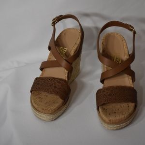 Tan leather Salvatore Ferragamo wedge sandals.